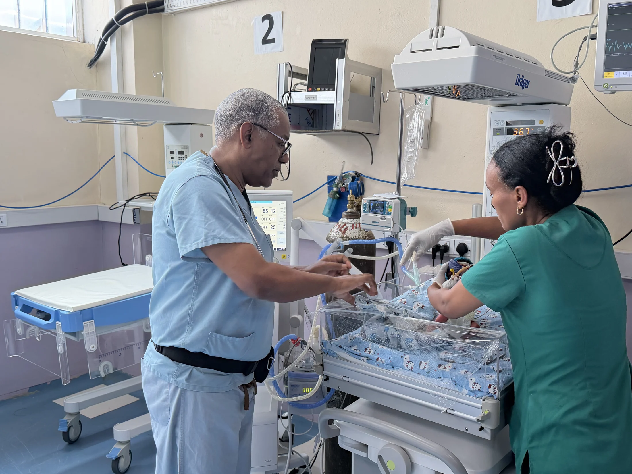 Medical professionals caring for a newborn in an Ethiopian neonatal unit